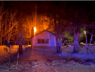 Man Jumps to Safety From Burning Home Near Cook